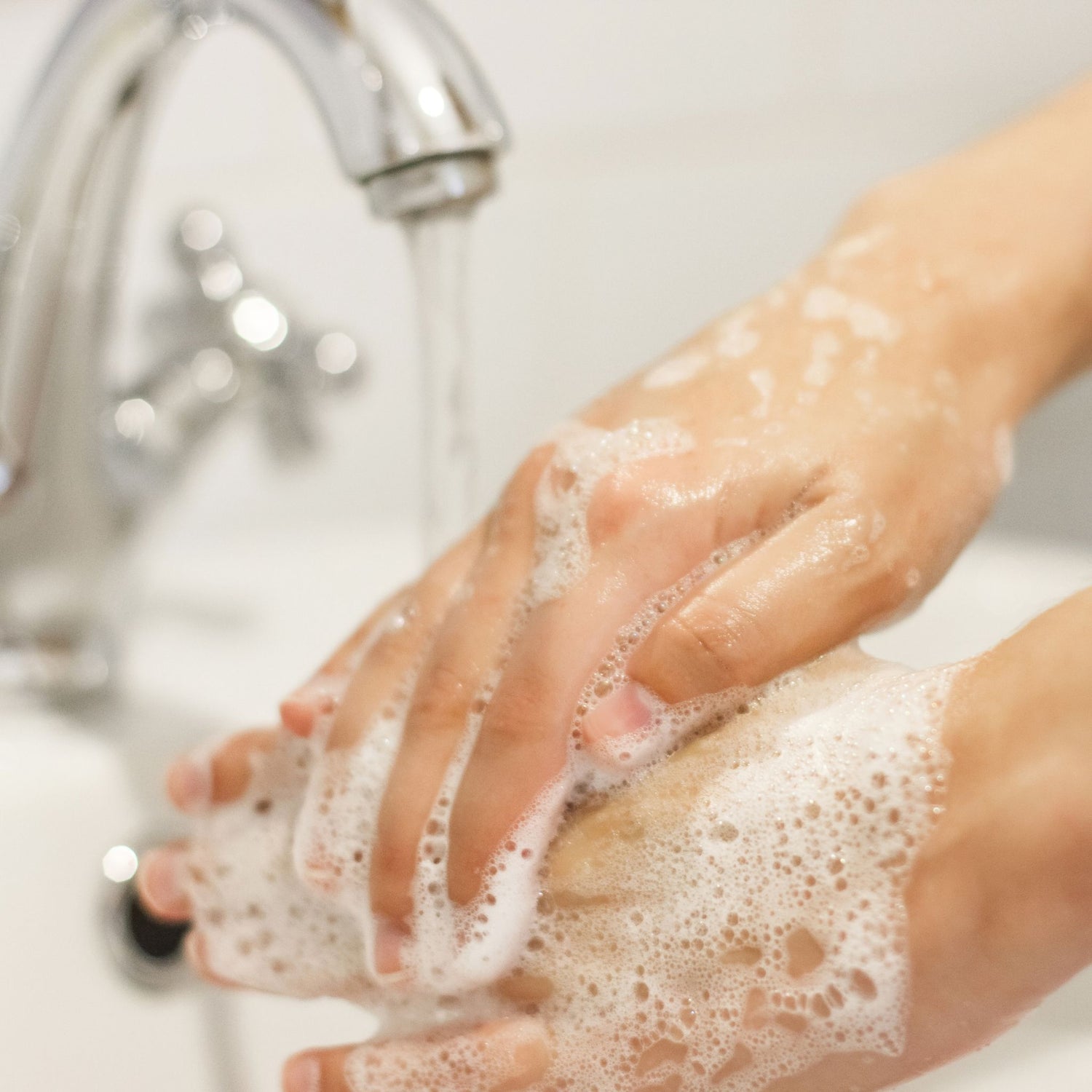 Washing hands with natural soap bar